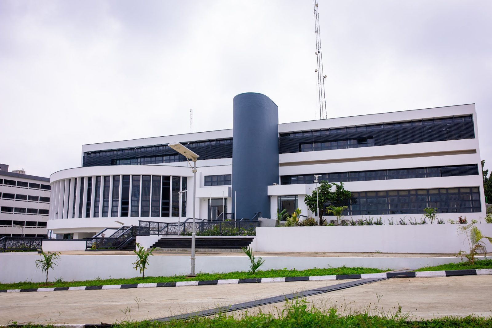 Front view of the Global Headquarters with its rounded wing and central tower